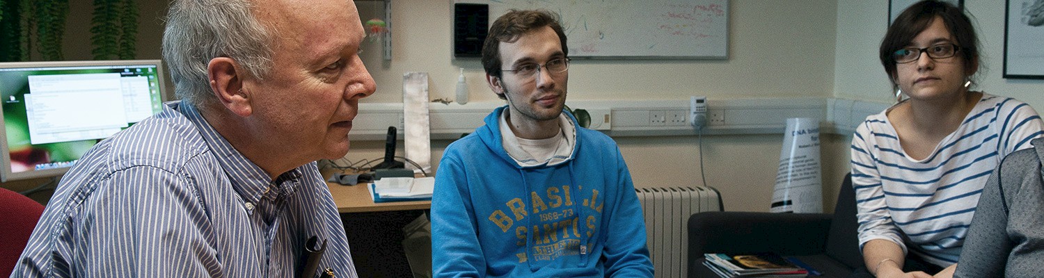 Adrian Bird in lab with researchers. Adrian Bird at his lab.